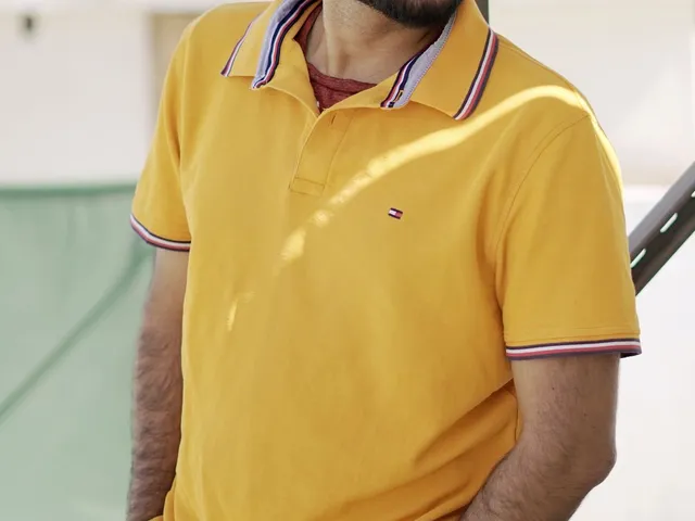 Casual portrait of a man in a yellow polo shirt