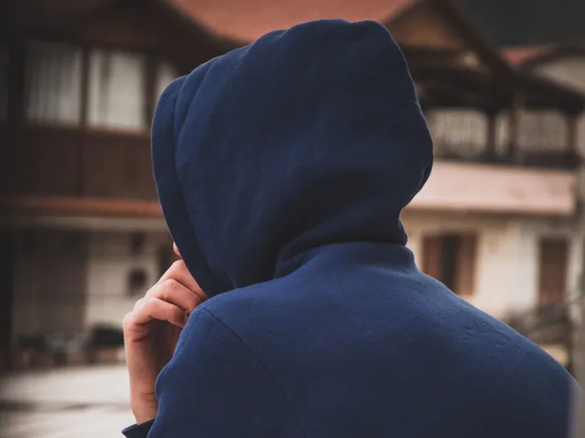 Back view of a person in a knit hoodie