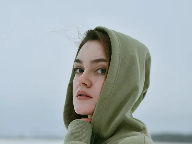 Young woman in a green knit hoodie