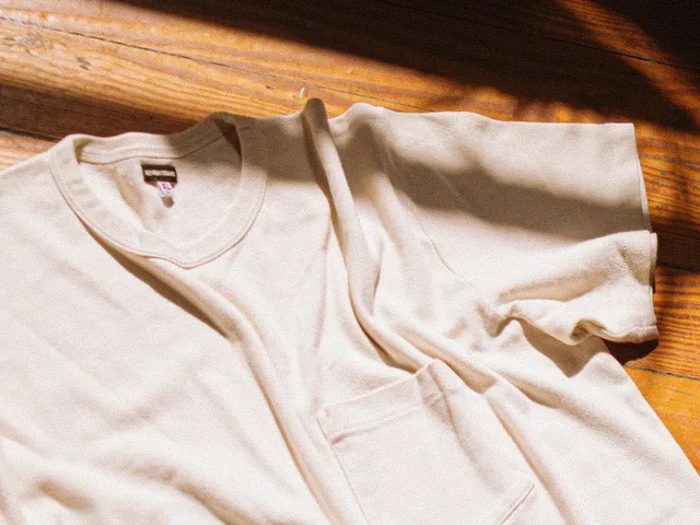 White knit t-shirt on a wooden floor