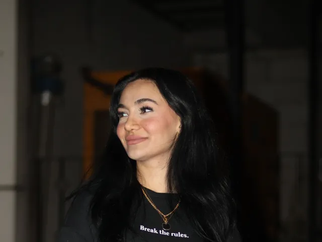 Portrait of a woman in a black pullover