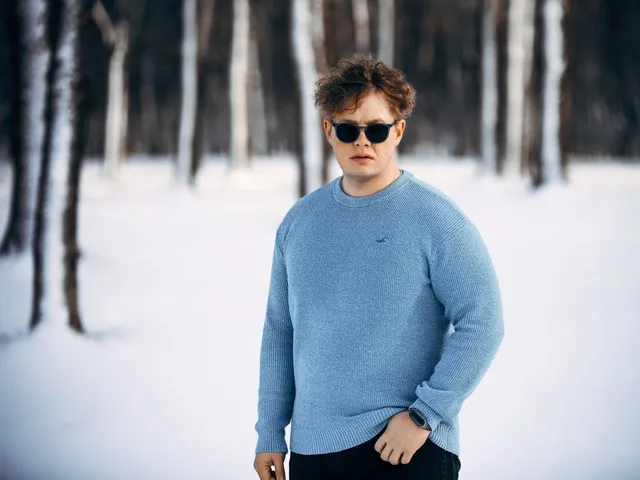 Man wearing a sweater in a winter forest