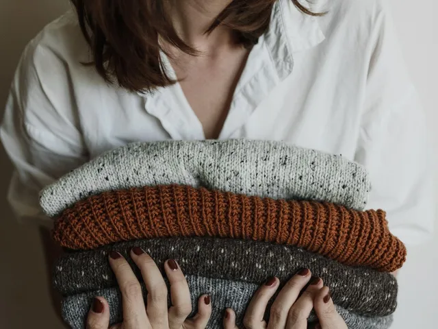 Close-up of folded knitted sweaters